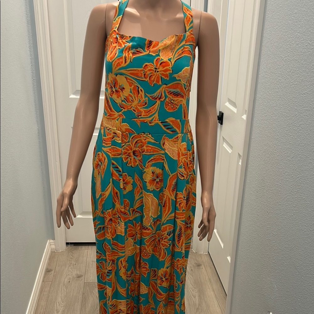 Floral Halter Maxi jumpsuit with windows on both sizes. Back zipper